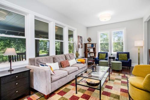 a living room with a couch and a table at Three Oaks Retreat in Three Oaks