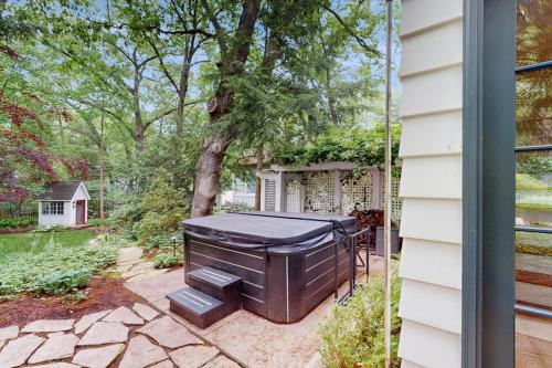 a hot tub in the backyard of a house at Chalet May in Michiana