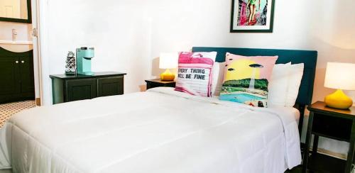 a bedroom with a bed with white sheets and pillows at Paul Revere in Provincetown