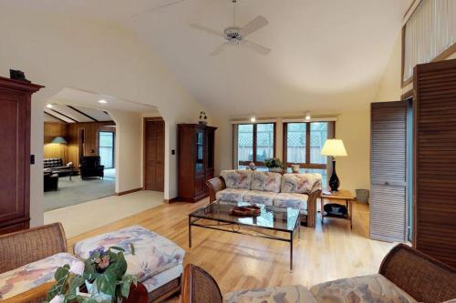 a living room with a couch and a table at Island Getaway in Oak Bluffs