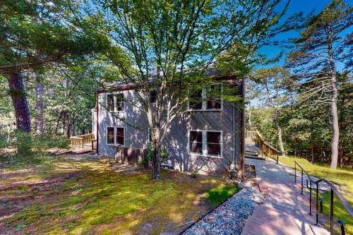 a small house in the middle of a yard at Old Kings Hideout in Wellfleet