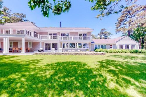 a large white house with a large yard at Follins Estate in Yarmouth Port