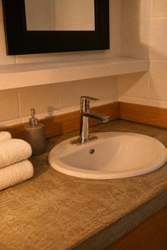 a bathroom sink with a faucet on a counter at Spahats Creek Resort in Clearwater