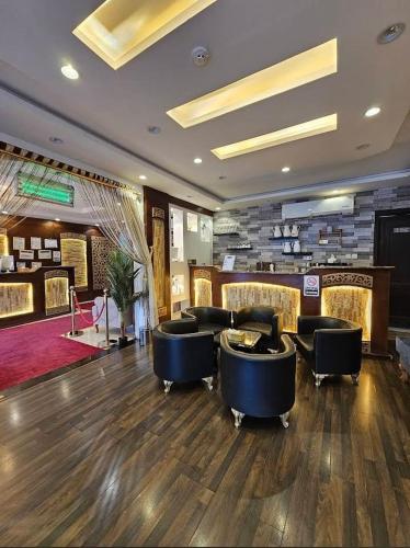 a lobby with couches and chairs in a salon at مسكن راحتك للشقق المخدومه in Tabuk