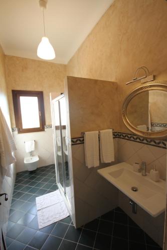 Ett badrum på Tenute Piazza Countryhouse