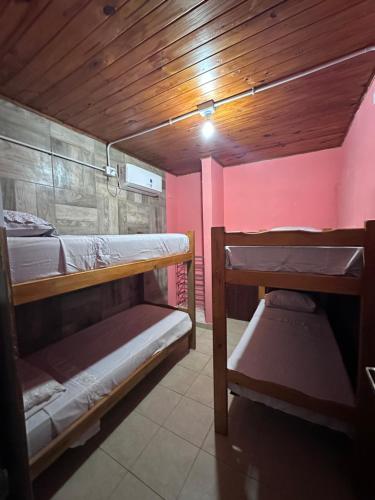 a bunk bed room with two bunk beds in it at Alojamiento Paz in Esquina