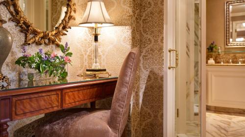 a room with a desk with a lamp and a chair at InterContinental Dublin by IHG in Dublin