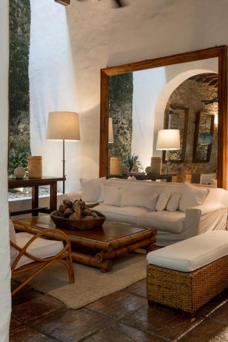 a living room with a white couch and a table at Amarla Boutique Hotel Cartagena in Cartagena de Indias