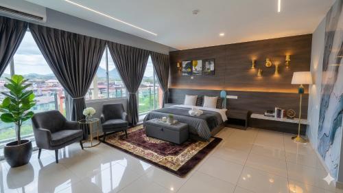 a bedroom with a bed and a large window at Lulala Boutique Hotel in Gerik