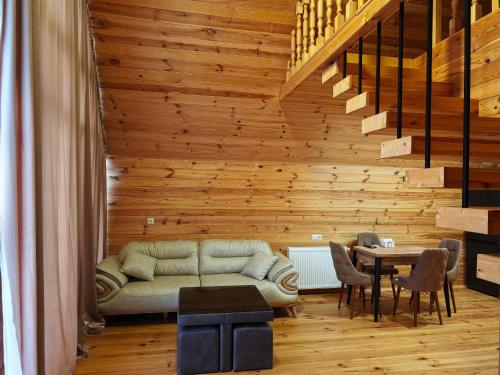 a living room with a couch and a table at Golden Coast in Batumi