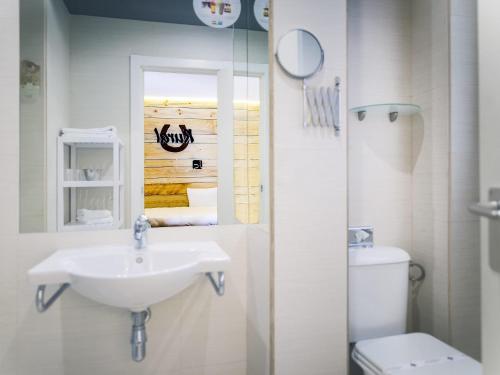 a bathroom with a sink and a toilet at Hotel Ibis Styles La Rioja Arnedo in Arnedo