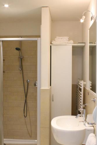 a bathroom with a shower and a sink at Wally Residence in Rimini