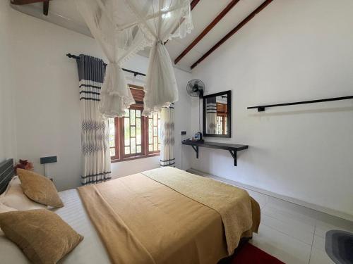 a bedroom with a bed and a window at Maya 44 Boutique Ella in Ella