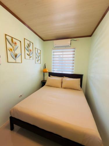 a bedroom with a large bed in a room at Skys Transient House Unit 1 in Manolo Fortich