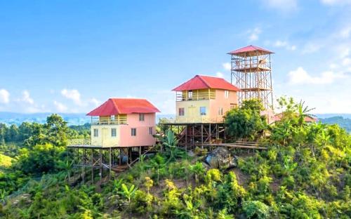 two houses on the top of a hill at Keyangjhiri Eco Resort, Lama, Bandarban in Bāndarban