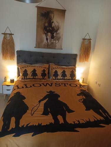a bedroom with a bed with a horse on it at Yellowstone in Kefalos