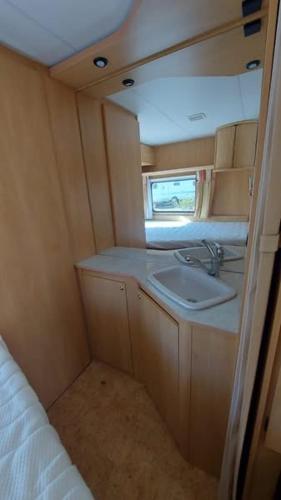 a small kitchen with a sink in an rv at Espacio Finca Alegría - Rural Houses & Rooms in Cartagena