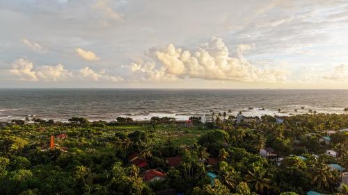an aerial view of a beach with the ocean at Silva Nest Recidencies in Galle