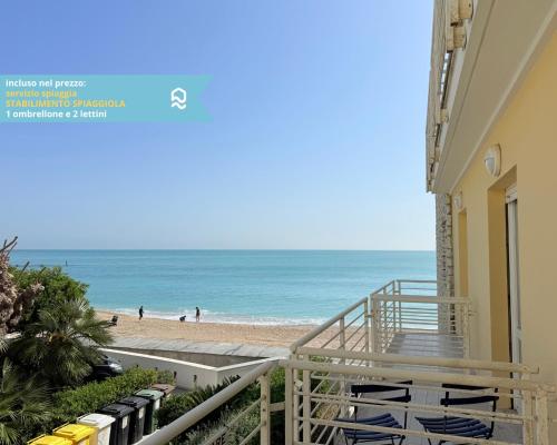 a view of the beach from the balcony of a building at Sogni blu in Numana