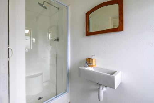 a bathroom with a sink and a shower at Disselblom Cottage in Sedgefield