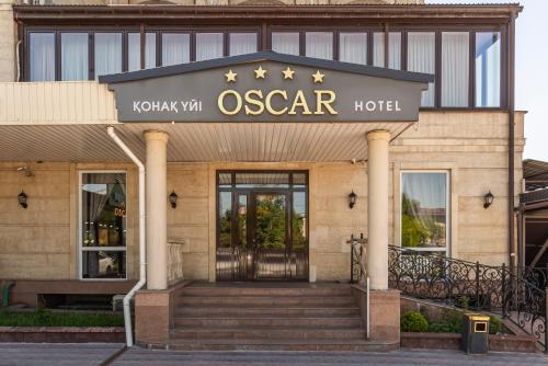 a oscar hotel with a sign on the door at Oscar Hotel by AG Hotels Group in Almaty