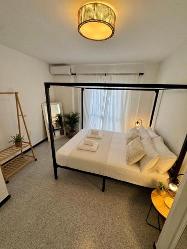 a bedroom with a bed and a window at Casa en el centro de Nerja- Calle Nueva 21 in Nerja