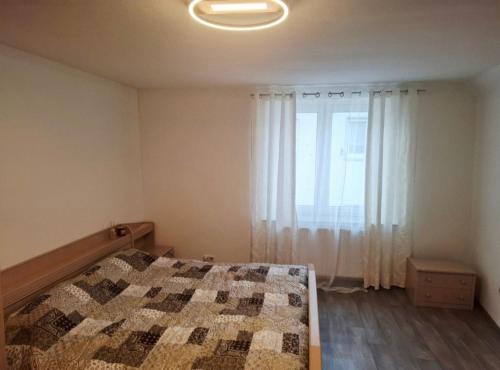 a bedroom with a bed and a large window at Cozy Apartment Koblenz in Koblenz