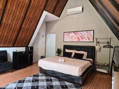 a bedroom with a large bed in a room at Aira Private Pool Glamping in Bandung