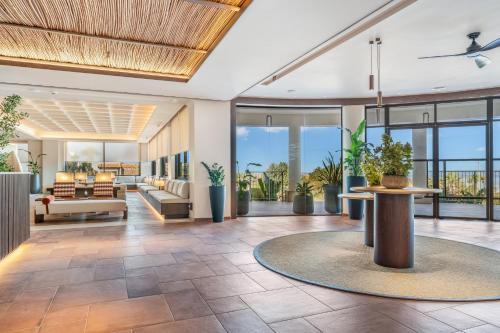 an open lobby with a couch and a table at Kouros Palace Active Lifestyle Hotel in Mastihari