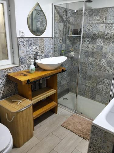 a bathroom with a sink and a shower at Finca Indalopez in Tabernas