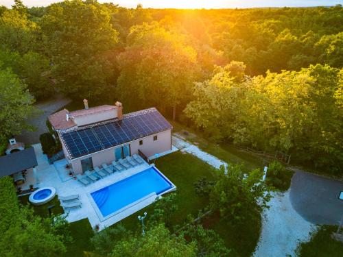 an overhead view of a house with a swimming pool at Villa Ferlini in Central Istria with private 10000 m2 garden, wellness & family activities on plot in Svetvinčenat