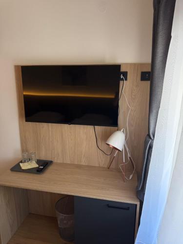 a desk with a lamp in a room at Gaja in Križpolje