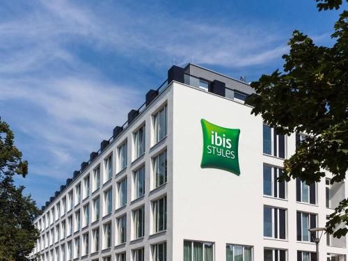 a large white building with aubs files sign on it at ibis Styles Rastatt Baden-Baden in Rastatt