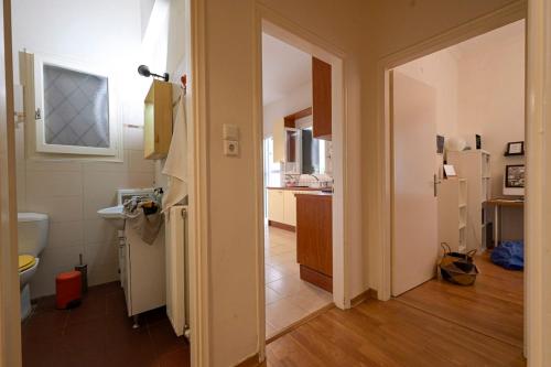 a room with a bathroom and a kitchen at Amimoni Apartment in Nafplio