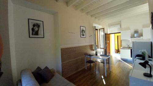 a living room with a couch and a table at Cavour 35 in Sulbiate