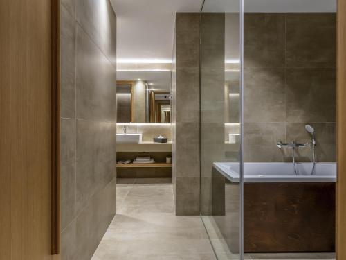 a bathroom with a shower and a sink at Ibis Styles Heraklion Central in Heraklio