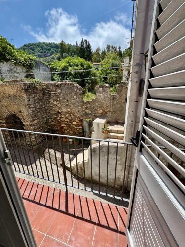 a balcony with a view of a castle at "DOMUS LEONE" - Nel Borgo di Capri Leone in Capri Leone