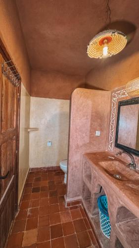 a bathroom with a sink and a toilet at merzouga stars luxury camp in Merzouga