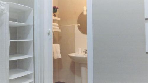 a small bathroom with a sink and a toilet at Domus Tua in Pietrelcina