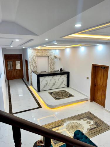 a living room with a large white room with at Hotel Royal Luxury Multan in Multan