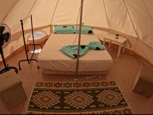 a bedroom with a bed in a tent at Glamping Costinești in Costinesti