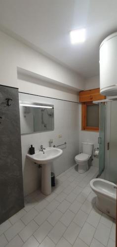 a bathroom with a sink and a toilet at Bellacation in Letojanni