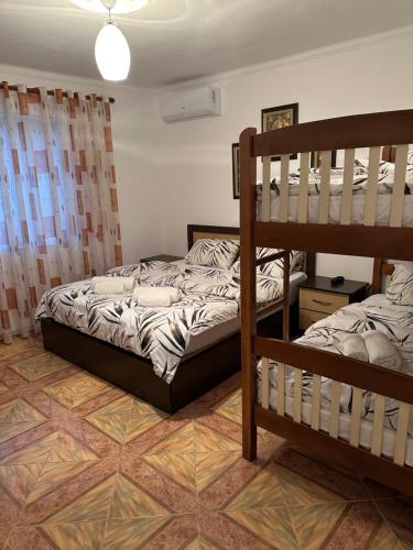 a bedroom with two bunk beds at Guest House Ajasllari in Çorovodë