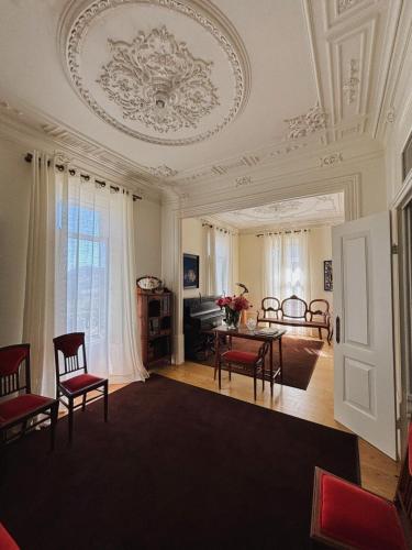 a living room with a table and chairs at Casal do Arcebispado in Felgueiras
