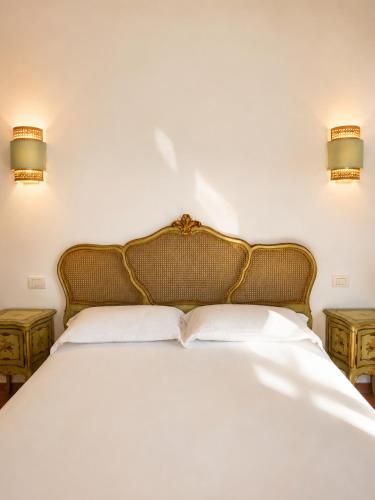 a bedroom with a bed with two night stands at ISOLA - Smart Accomodation in Messina
