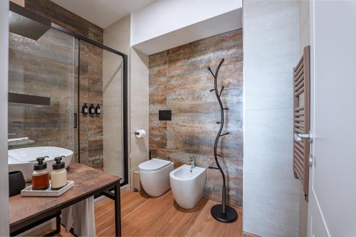 a bathroom with a shower and a toilet and a sink at 266 La Barraca in Torvaianica