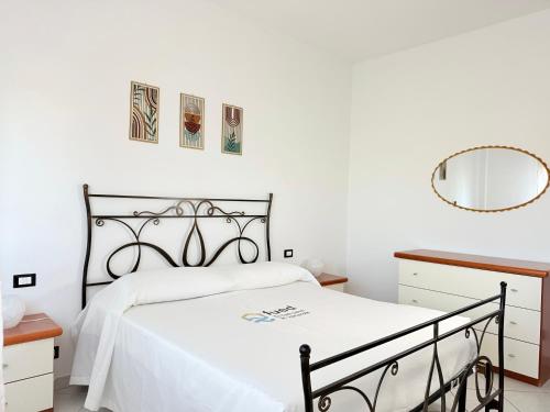 a bedroom with a bed and a mirror at C019 - Camerano, ampio trilocale con WiFi in Camerano