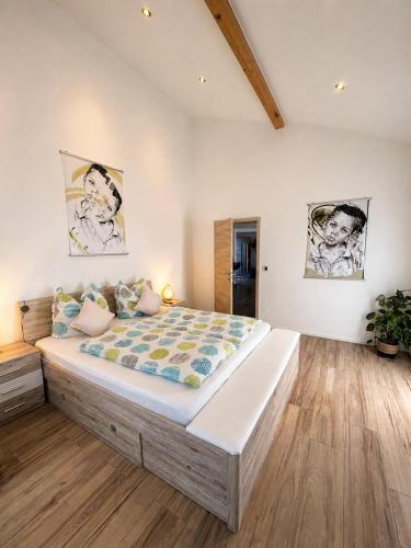 a bedroom with a large bed in a room at Ferienwohnung 'Moseltraum' in Ensch