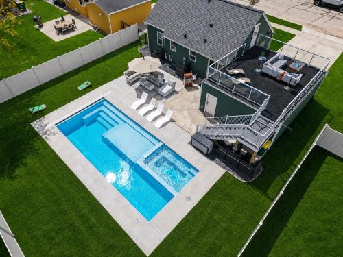 an overhead view of a house with a swimming pool at Lambeau View Pool Rooftop Entertainment Room in Green Bay