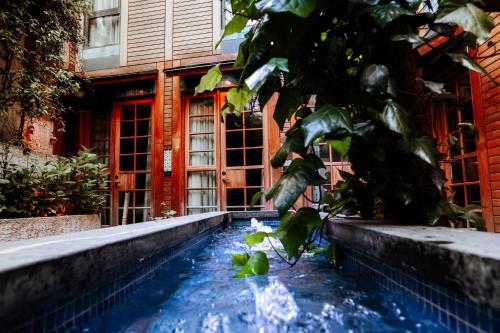 a house with a swimming pool in front of a building at Henna Hotel Istanbul in Istanbul